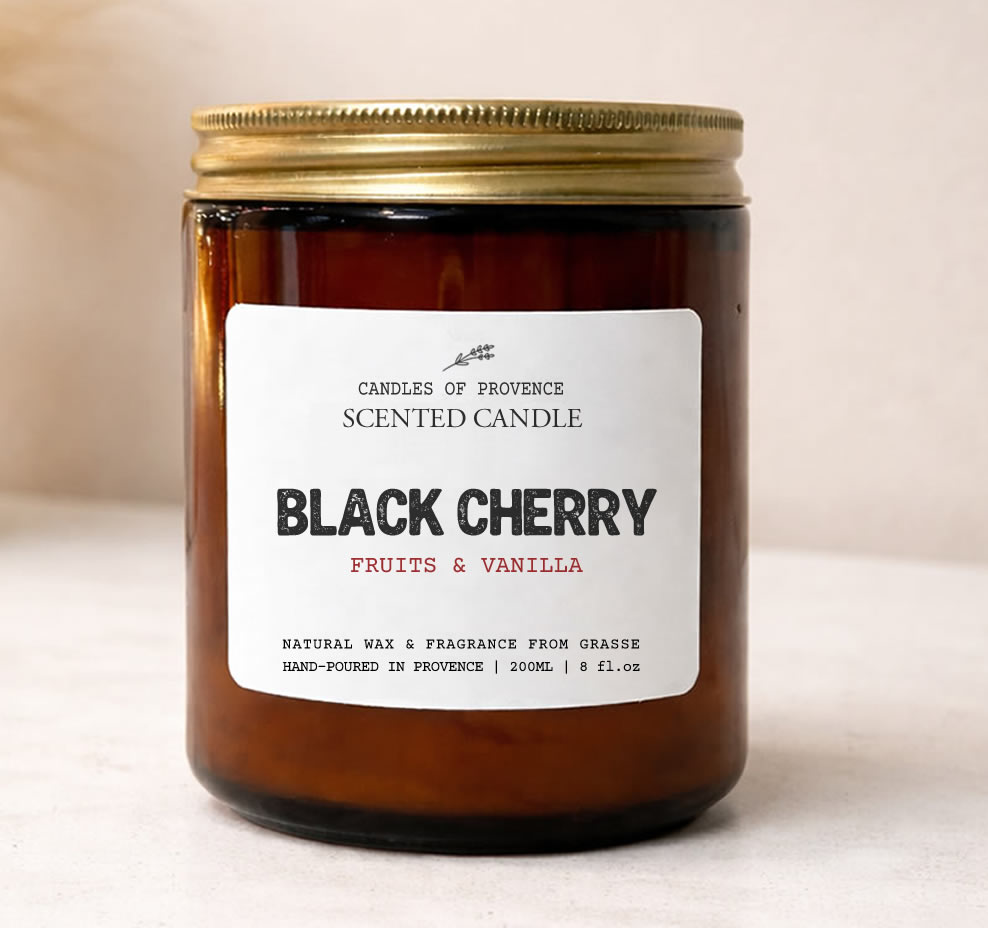 Hand-poured Black Cherry scented candle in amber apothecary jar made with natural soy wax.