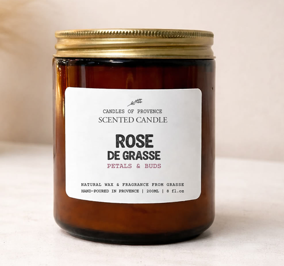 Hand-poured Rose de Grasse scented candle in amber apothecary jar made with natural soy wax.
