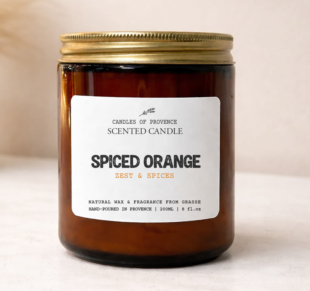 Hand-poured Spiced Orange scented candle in amber apothecary jar made with natural soy wax.