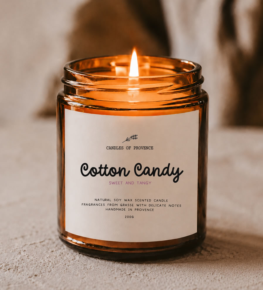 Cotton Candy Scented Candle from the Apothecary Collection in an amber glass jar