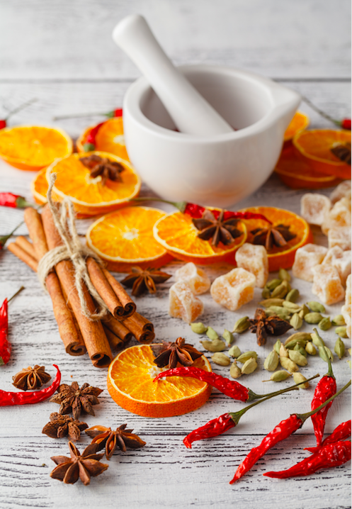 Dried oranges and aromatic spices inspiring the Spiced Orange Scented Candle